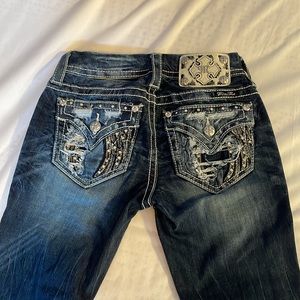 Miss Me boot cut dark blue jeans! With bling on the back pockets. Size 24